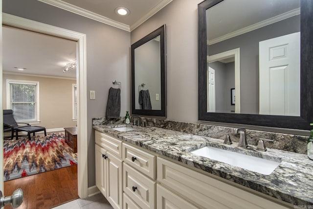 bathroom featuring tile patterned floors, vanity, and ornamental molding