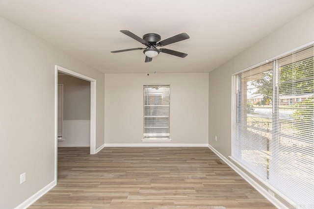 empty room featuring ceiling fan and light hardwood / wood-style flooring