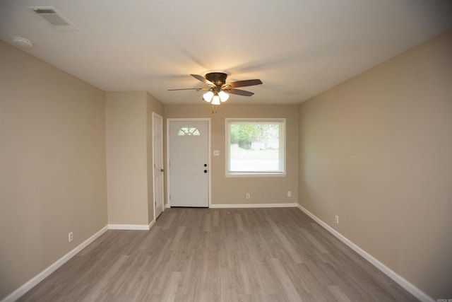 entrance foyer with ceiling fan and light wood-type flooring