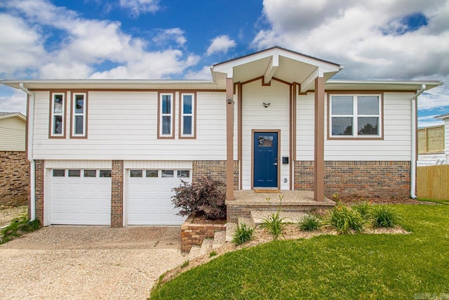 view of front of house with a front lawn and a garage