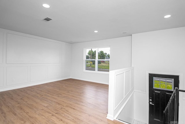 unfurnished room with light hardwood / wood-style flooring