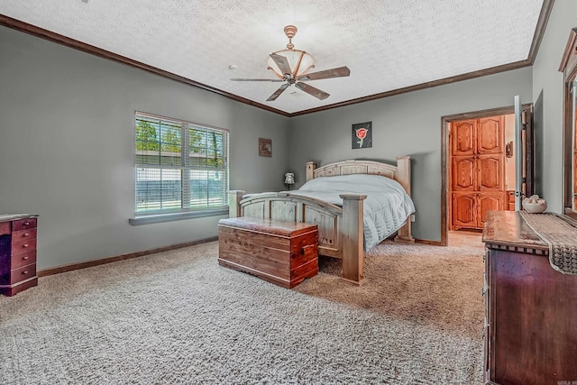 carpeted bedroom featuring ceiling fan, crown molding, and a textured ceiling