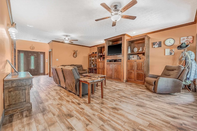 living room with ceiling fan, crown molding, a textured ceiling, and light hardwood / wood-style flooring