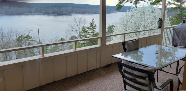 balcony featuring a water view