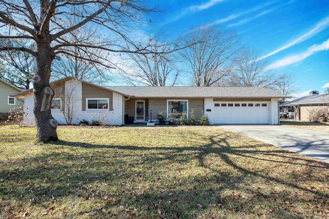 ranch-style home featuring a garage and a front yard