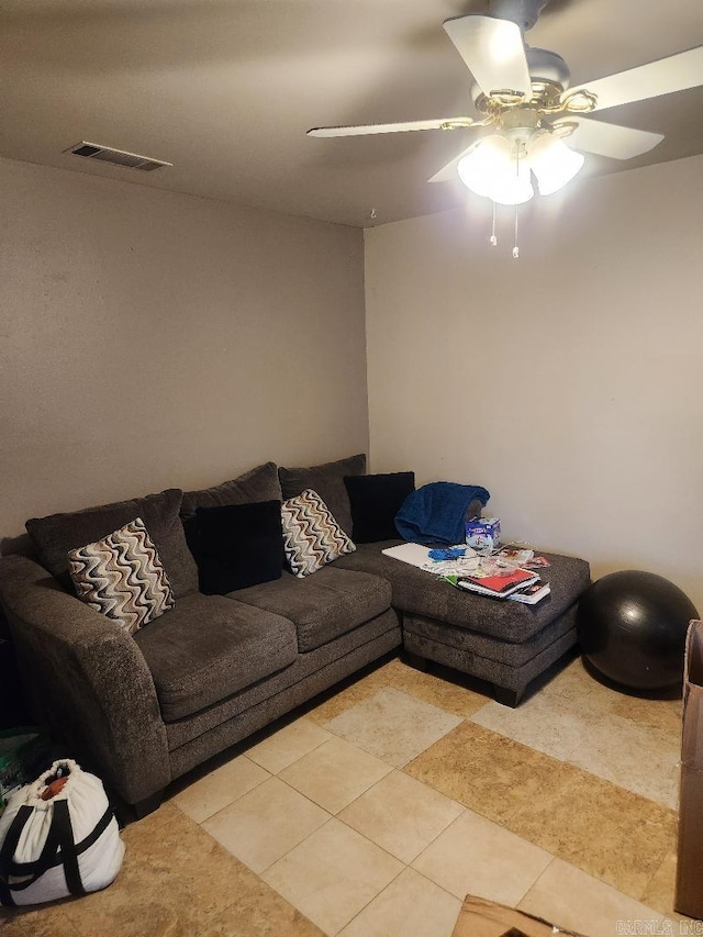 tiled living room featuring ceiling fan