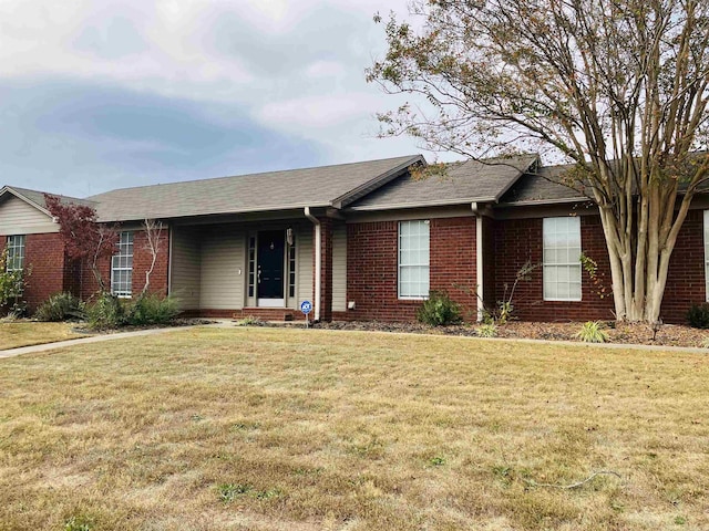 ranch-style home with a front yard