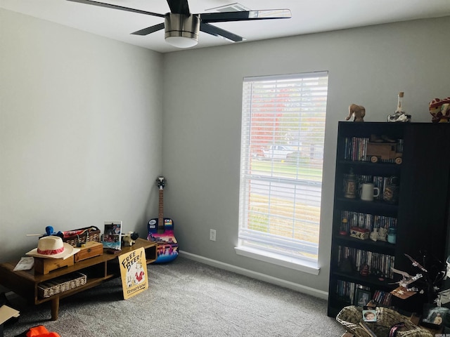 miscellaneous room with plenty of natural light, ceiling fan, and carpet flooring