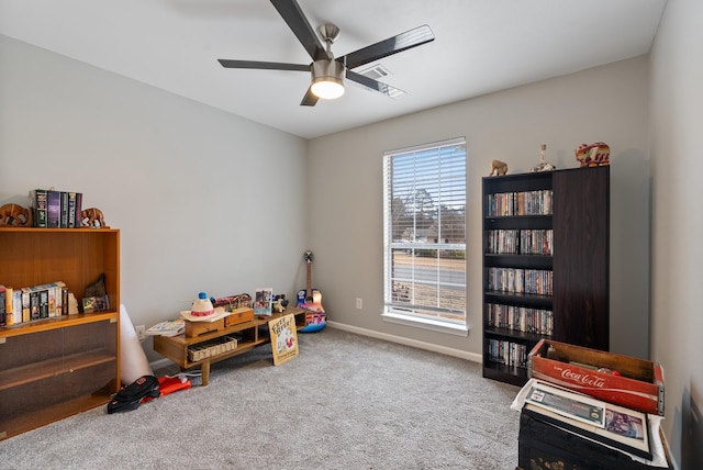 recreation room featuring carpet and ceiling fan