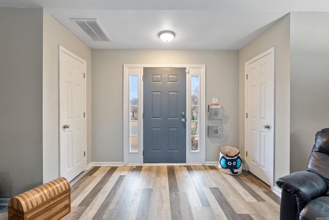 entrance foyer with light hardwood / wood-style floors