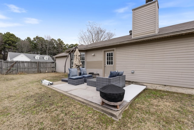 back of property featuring a yard, an outdoor hangout area, and a patio