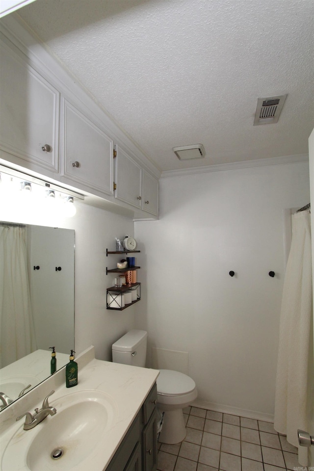 bathroom with tile patterned flooring, a textured ceiling, toilet, vanity, and ornamental molding