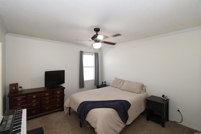 bedroom with ceiling fan, carpet floors, and ornamental molding