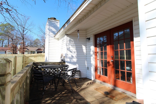 wooden deck featuring french doors