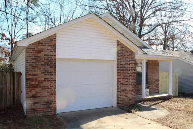 exterior space with an outbuilding and a garage