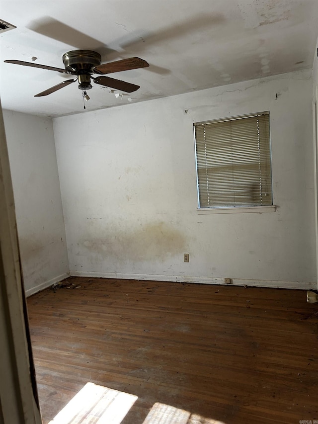 spare room featuring ceiling fan and hardwood / wood-style floors