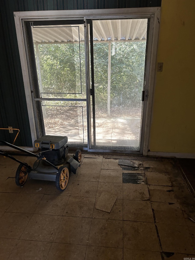 doorway with tile patterned floors