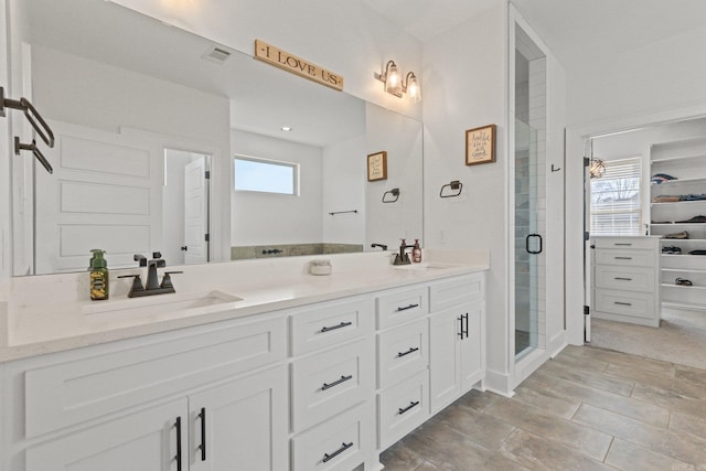 bathroom featuring vanity and walk in shower