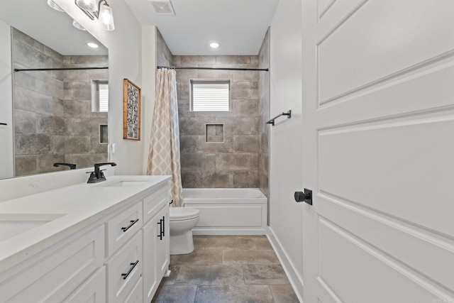 full bathroom with vanity, toilet, and shower / tub combo