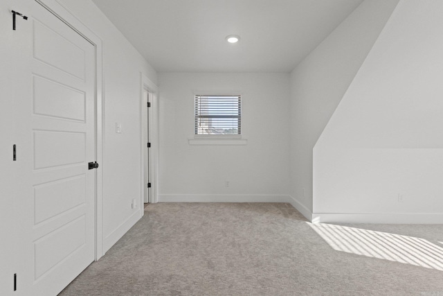 spare room with light carpet