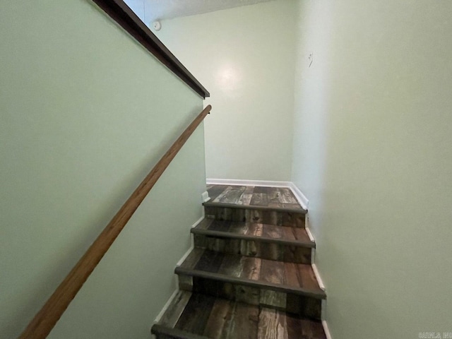 stairway featuring hardwood / wood-style flooring