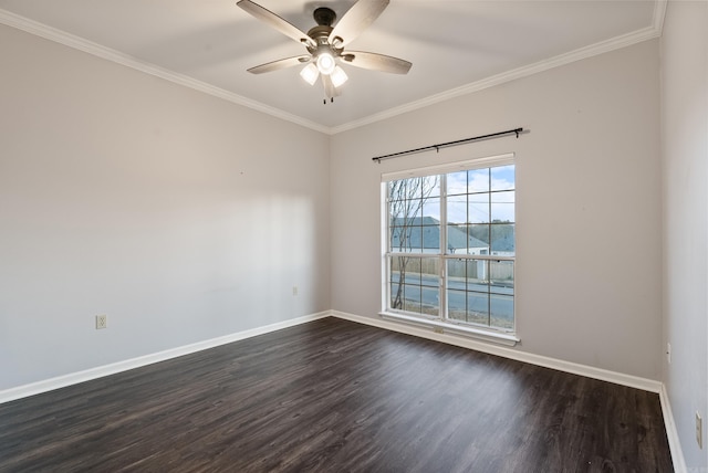 empty room featuring ornamental molding, ceiling fan, and dark wood-type flooring