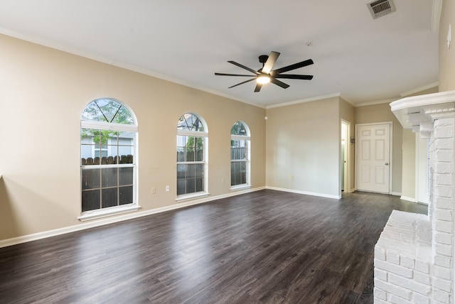 unfurnished living room featuring ceiling fan, dark hardwood / wood-style flooring, crown molding, and a brick fireplace