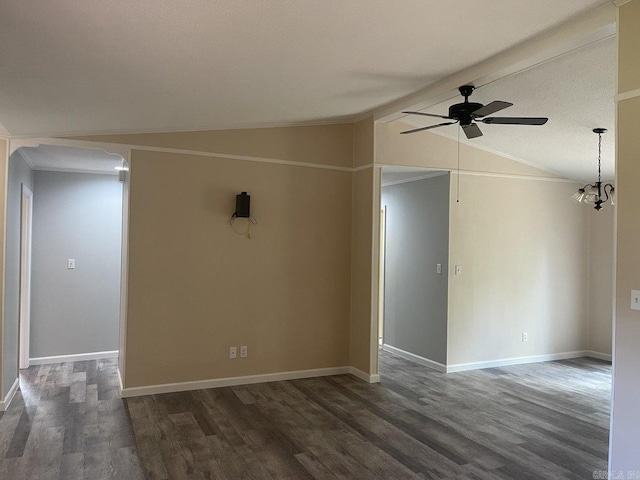 unfurnished room with ceiling fan with notable chandelier, dark hardwood / wood-style flooring, vaulted ceiling with beams, and a textured ceiling