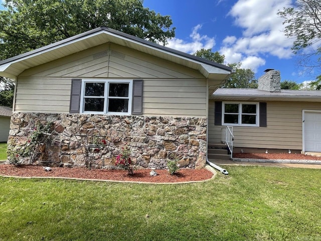 view of home's exterior featuring a lawn