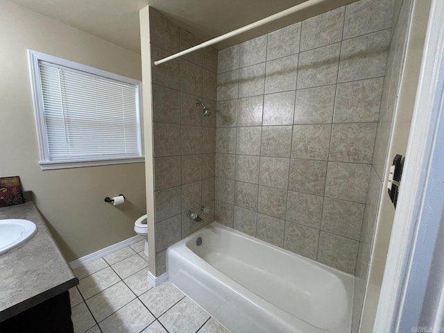 full bathroom featuring tile patterned flooring, vanity, toilet, and tiled shower / bath