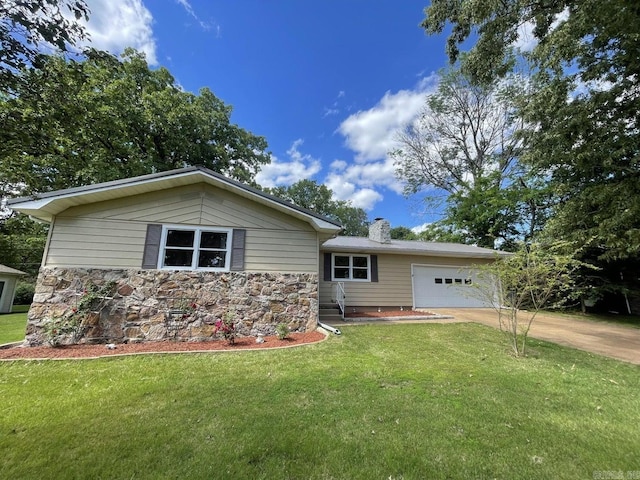 view of front of home featuring a garage and a front lawn