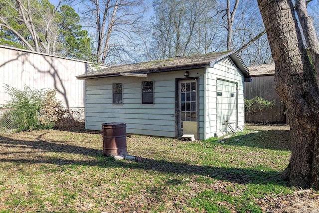 view of outbuilding featuring a lawn