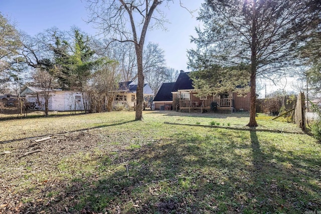 view of yard with a wooden deck