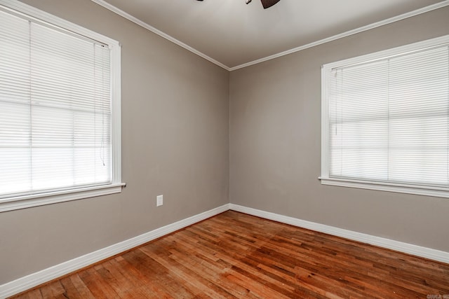 spare room with hardwood / wood-style flooring, ceiling fan, and ornamental molding