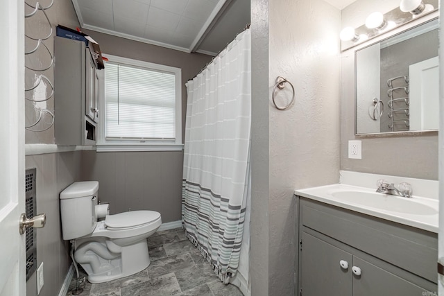 bathroom with a shower with curtain, vanity, toilet, and ornamental molding