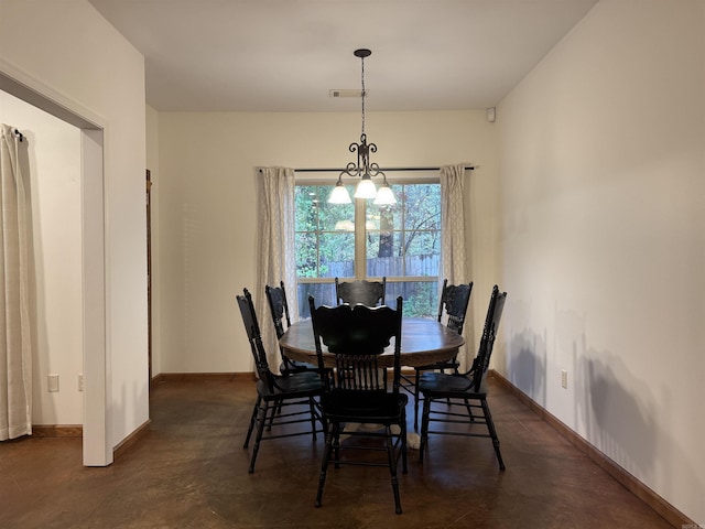 dining space featuring a notable chandelier