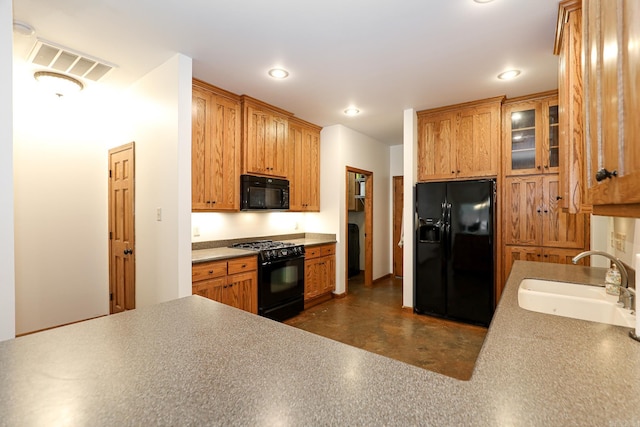 kitchen with sink and black appliances