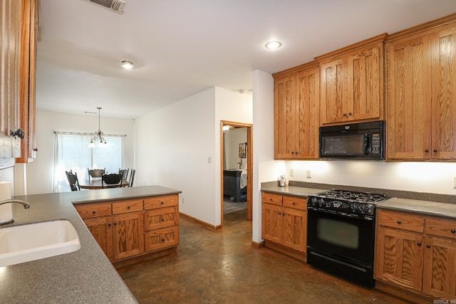 kitchen featuring a chandelier, pendant lighting, sink, and black appliances