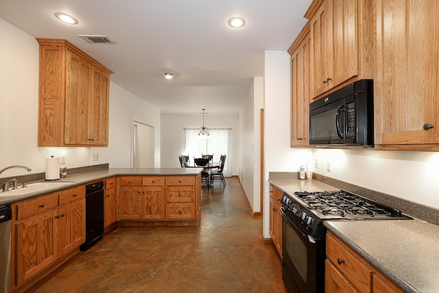 kitchen with black appliances, decorative light fixtures, kitchen peninsula, and sink