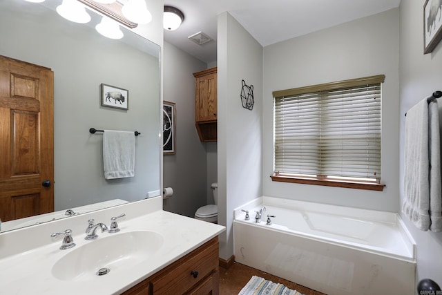 bathroom featuring vanity, toilet, and a bathtub