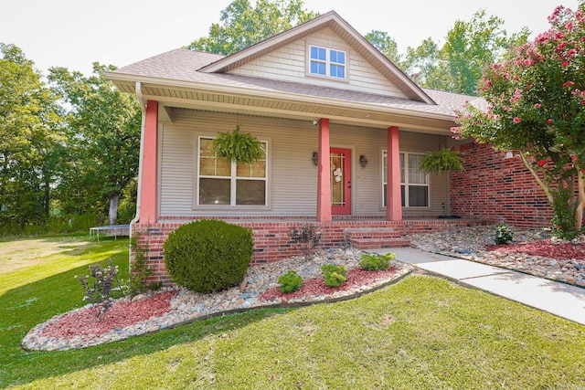 view of front of house with a porch and a trampoline