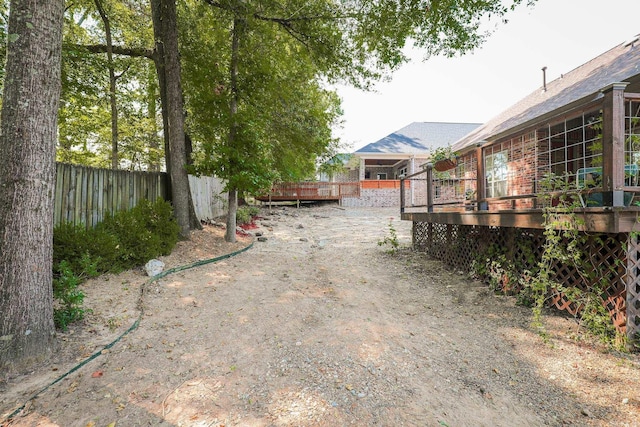 view of yard with a wooden deck