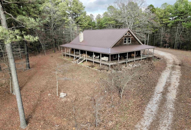 farmhouse-style home featuring a porch