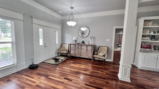 entrance foyer featuring decorative columns, dark wood-type flooring, and a healthy amount of sunlight