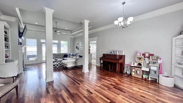 interior space with ornate columns, crown molding, dark hardwood / wood-style flooring, and ceiling fan with notable chandelier