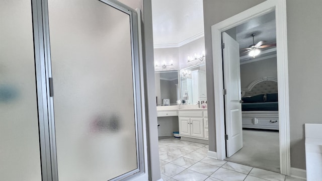 bathroom featuring tile patterned floors, ceiling fan, a shower with shower door, and ornamental molding