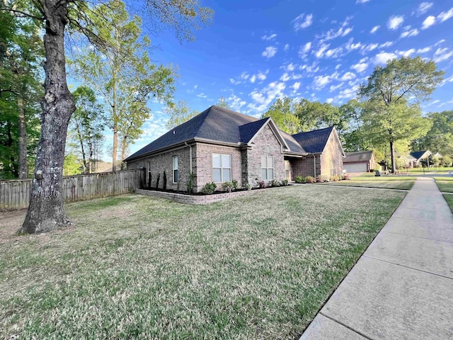 view of front of home featuring a front lawn