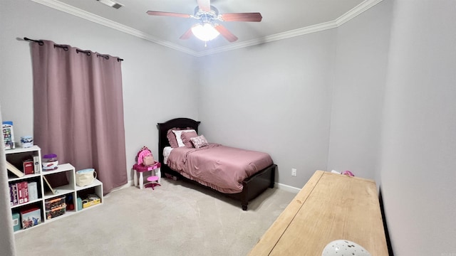 carpeted bedroom with ceiling fan and ornamental molding