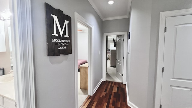 hallway featuring dark hardwood / wood-style flooring and ornamental molding