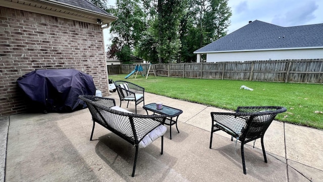 view of patio / terrace featuring a playground and grilling area